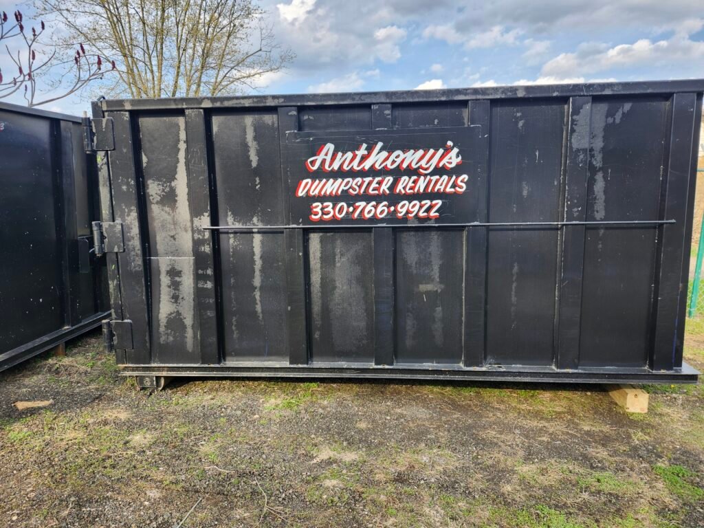 Anthony's Dumpster Rentals black Dumpster in yard - Canton Ohio